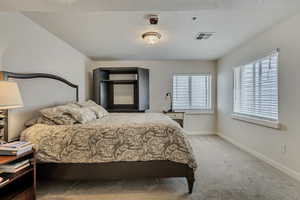 Bedroom with carpet and baseboards