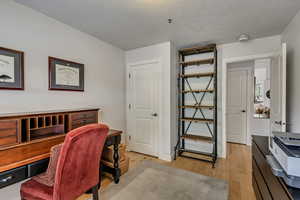 Office with light wood finished floors