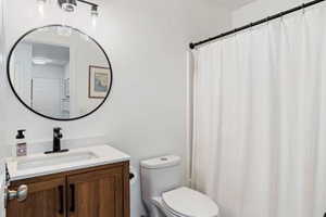 Bathroom with toilet and vanity