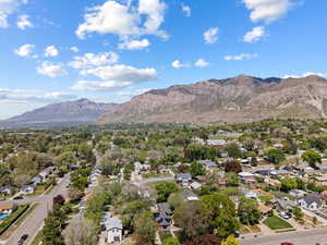 Aerial perspective of suburban area with a mountainous background