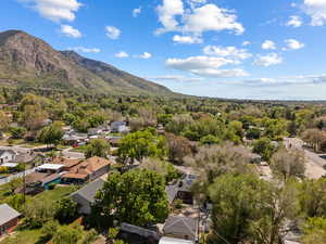 Aerial perspective of suburban area with a mountainous background