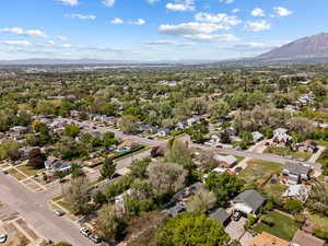 Aerial perspective of suburban area with a mountain backdrop