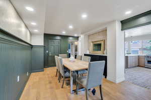 Dining room featuring light wood finished floors, recessed lighting, and baseboards