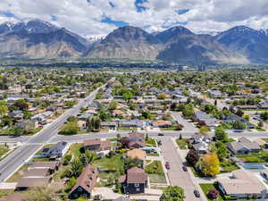 Aerial perspective of suburban area with a mountainous background
