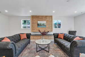 Living area featuring plenty of natural light, recessed lighting, and wood finished floors