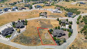 Aerial perspective of suburban area featuring property parcel outlined
