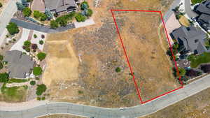 Aerial view of residential area with property parcel outlined