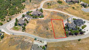 Aerial perspective of suburban area with property parcel outlined