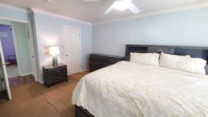 Bedroom featuring light colored carpet, crown molding, baseboards, and a ceiling fan