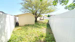 View of yard featuring a storage shed