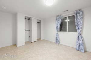 Unfurnished bedroom featuring baseboards and a closet