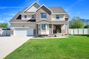 View of front of property with stucco siding, a gate, driveway, an attached garage, and roof with shingles