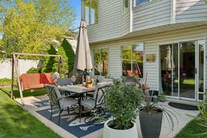 View of patio featuring fence and outdoor dining space