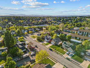 Aerial perspective of suburban area featuring a mountain backdrop
