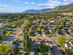 Aerial view of residential area featuring a mountainous background