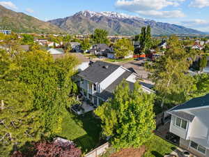 Aerial perspective of suburban area with a mountain backdrop