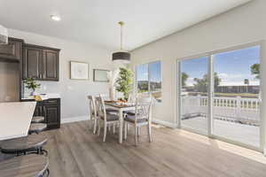 Dining room with baseboards and light wood-style flooring