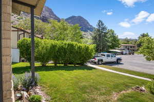 View of green lawn with a mountain view