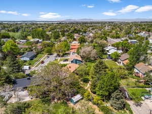 Aerial perspective of suburban area featuring a mountain backdrop