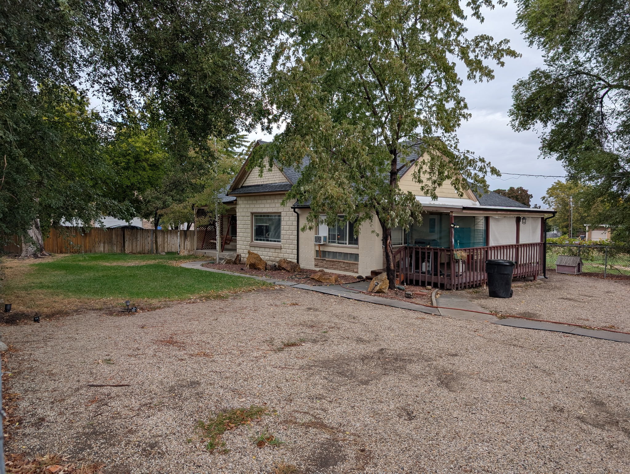 Back of property with roof with shingles