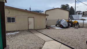 View of outdoor structure featuring an outdoor structure and fence