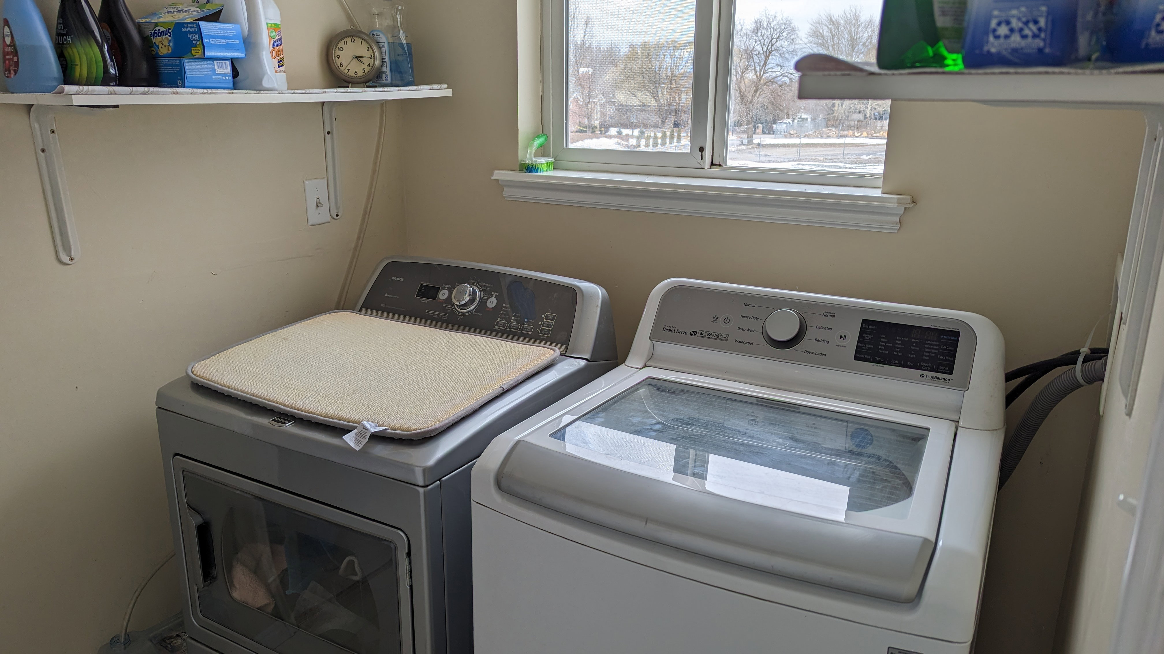 Laundry room featuring laundry area and washer and clothes dryer