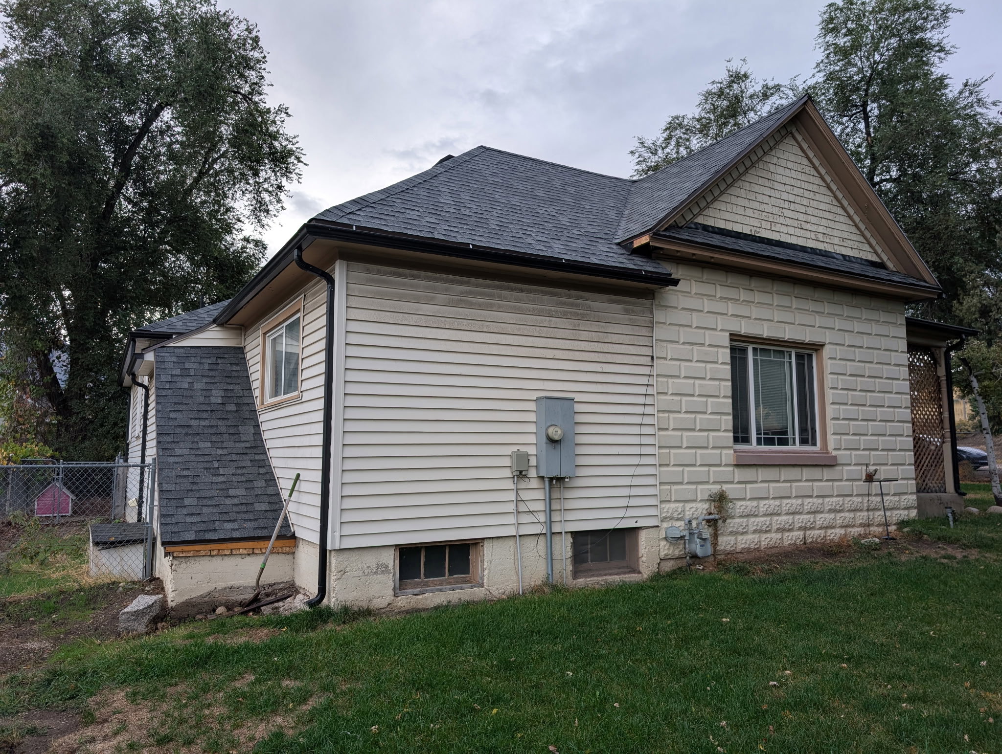 View of home's exterior with a shingled roof