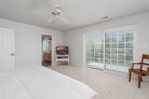 Bedroom featuring multiple windows, carpet, baseboards, and ceiling fan
