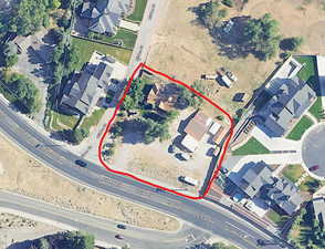 Aerial map of property and surrounding area featuring property boundaries highlighted