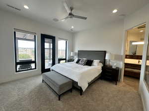 Bedroom with carpet, multiple windows, recessed lighting, connected bathroom, and ceiling fan