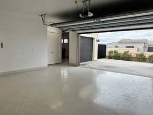 Garage featuring a garage door opener