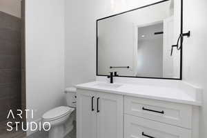 Bathroom with vanity and toilet