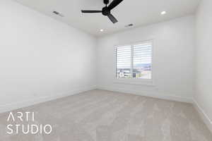 Spare room with ceiling fan, light carpet, baseboards, and recessed lighting