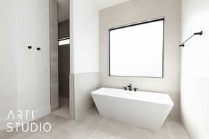 Bathroom featuring a freestanding bath and tile patterned flooring