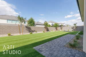 View of yard featuring a residential view and a patio