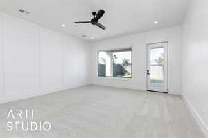 Unfurnished room featuring light colored carpet, ceiling fan, recessed lighting, and baseboards