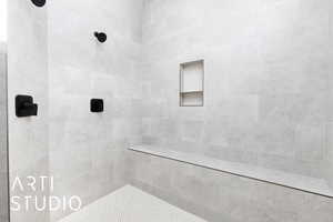 Bathroom featuring a tile shower