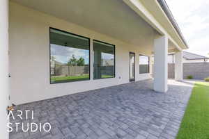 View of patio with fence