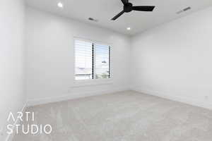 Spare room with carpet flooring, ceiling fan, baseboards, and recessed lighting