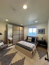 Bedroom featuring recessed lighting and a textured ceiling