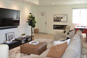 Living room with wood finished floors and recessed lighting