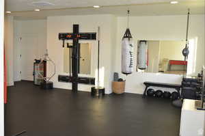 Exercise area featuring baseboards and recessed lighting