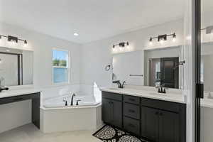 Full bath featuring double vanity, a bath, and a shower