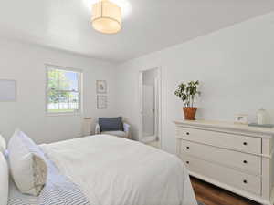 Bedroom featuring dark wood-type flooring
