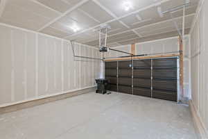 Garage featuring a garage door opener