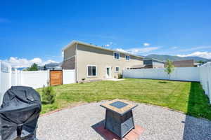 Back of property featuring stucco siding and a patio area