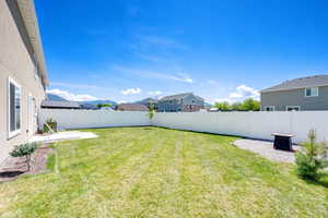 View of yard featuring a patio area and a residential view