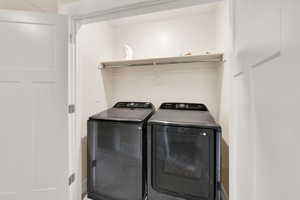 Washroom featuring independent washer and dryer