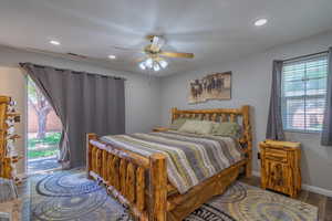 Bedroom with wood finished floors, access to exterior, recessed lighting, baseboards, and a ceiling fan