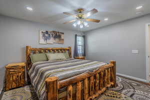 Bedroom with baseboards, recessed lighting, ceiling fan, and wood finished floors